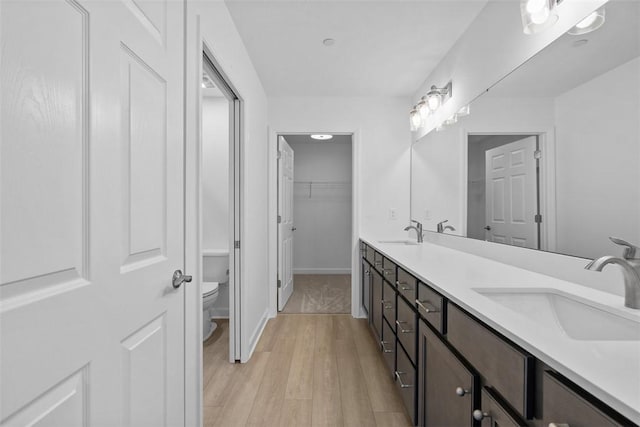 1082 Forest Oaks Dr, Center Twp, PA 16001 - full bath with double vanity, wood finished floors, and a walk in closet