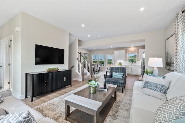 180 Elk Ridge Dr, Moon/Crescent Twp, PA 15108 - living room with light wood-type flooring, stairway, and recessed lighting