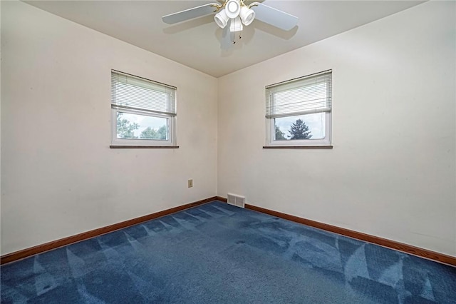 119 S Patton, Moon/Crescent Twp, PA 15108 - empty room with healthy amount of natural light, dark colored carpet, and ceiling fan