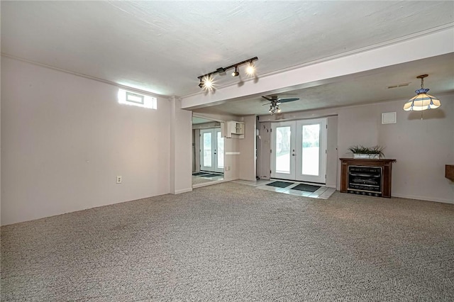 119 S Patton, Moon/Crescent Twp, PA 15108 - unfurnished living room with healthy amount of natural light, carpet flooring, french doors, and a ceiling fan