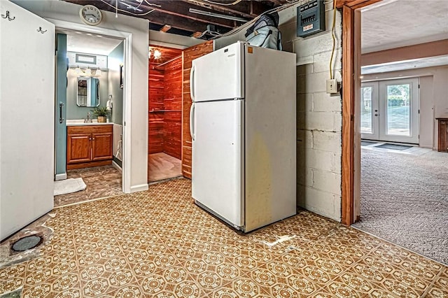 119 S Patton, Moon/Crescent Twp, PA 15108 - kitchen featuring freestanding refrigerator, concrete block wall, brown cabinetry, and a heating unit