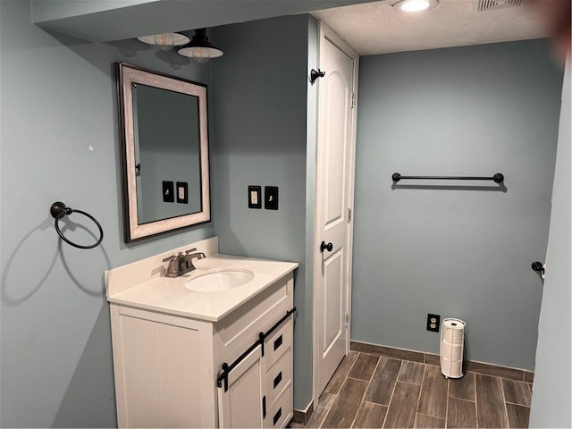 118 Manchester Dr, Hempfield Twp, PA 15642 - bathroom with vanity and wood finished floors