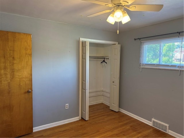 118 Manchester Dr, Hempfield Twp, PA 15642 - unfurnished bedroom with wood finished floors, a closet, and a ceiling fan