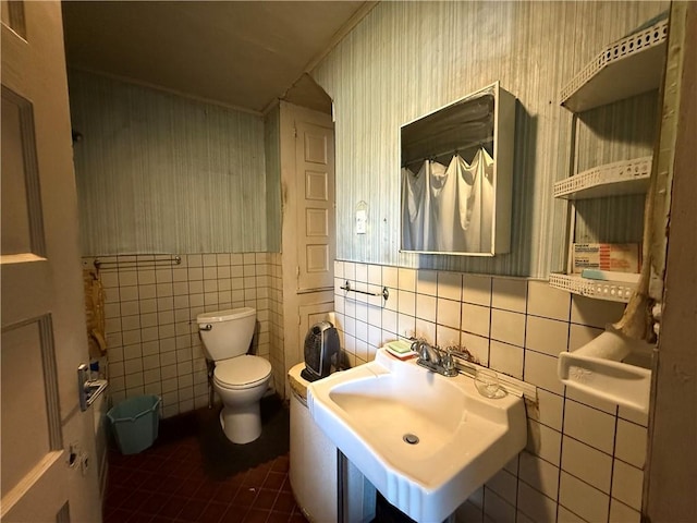 66 Beech St, Cecil, PA 15350 - bathroom featuring tile walls, tile patterned floors, wallpapered walls, and wainscoting