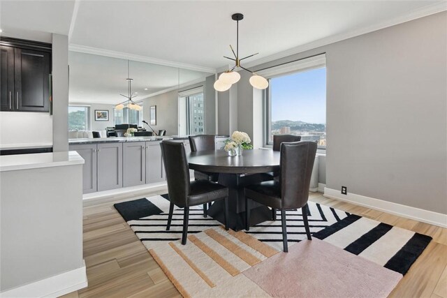 320 Fort Duquesne Blvd Unit 23L, Downtown Pgh, PA 15222 - dining space with crown molding and light wood-type flooring