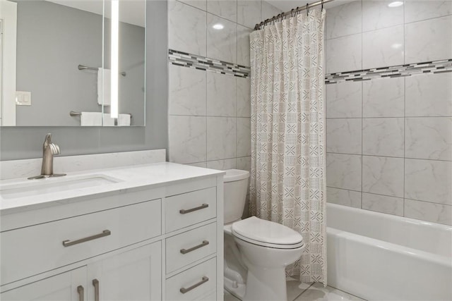 320 Fort Duquesne Blvd Unit 23L, Downtown Pgh, PA 15222 - bathroom featuring vanity, shower / tub combo with curtain, and tile walls