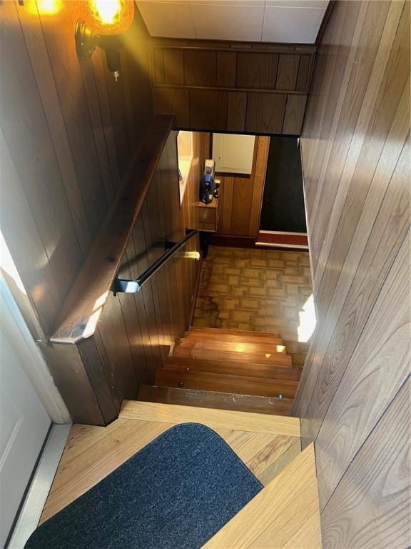 4619 5th Ave, Beaver Falls, PA 15010 - stairs featuring wood walls and parquet flooring