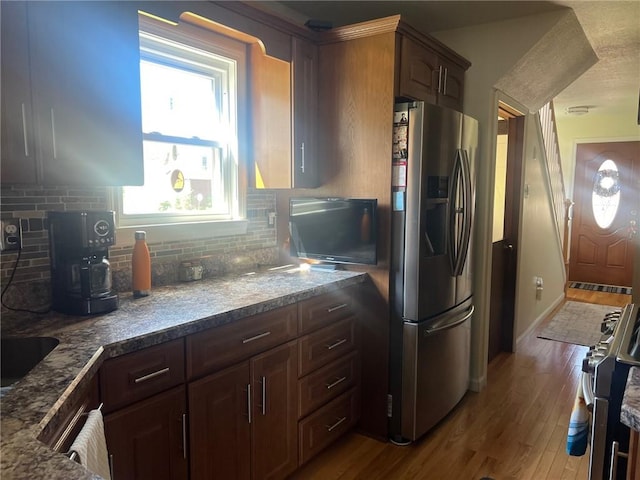 4619 5th Ave, Beaver Falls, PA 15010 - kitchen featuring appliances with stainless steel finishes, tasteful backsplash, and wood finished floors