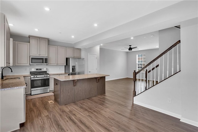 222 Amon St, Cranberry Twp, PA 16066 - kitchen featuring appliances with stainless steel finishes, a center island, a ceiling fan, a breakfast bar, and recessed lighting