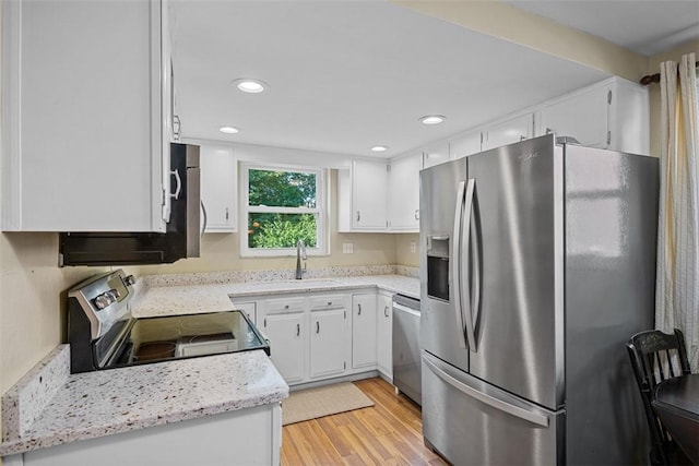 723 Rose Ln, Baldwin Twp, PA 15234 - kitchen featuring appliances with stainless steel finishes, light wood finished floors, white cabinetry, and recessed lighting