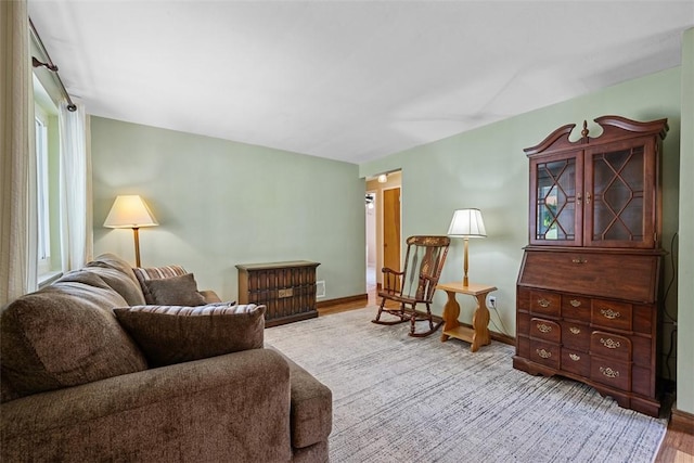 723 Rose Ln, Baldwin Twp, PA 15234 - living area featuring wood finished floors and baseboards