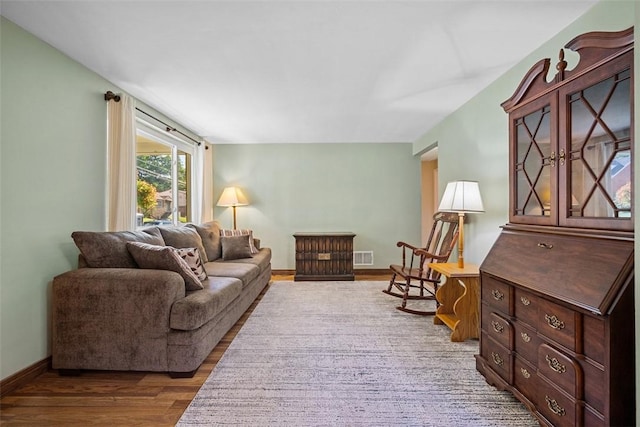 723 Rose Ln, Baldwin Twp, PA 15234 - living area featuring wood finished floors and baseboards