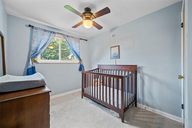 723 Rose Ln, Baldwin Twp, PA 15234 - bedroom featuring carpet, a nursery area, and a ceiling fan