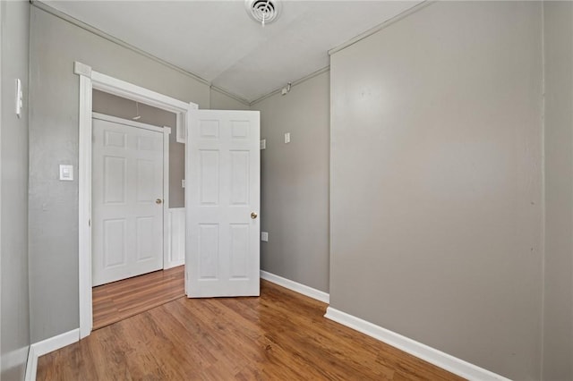 213 Mcdonald Dr, North Huntingdon, PA 15642 - empty room featuring wood finished floors and vaulted ceiling