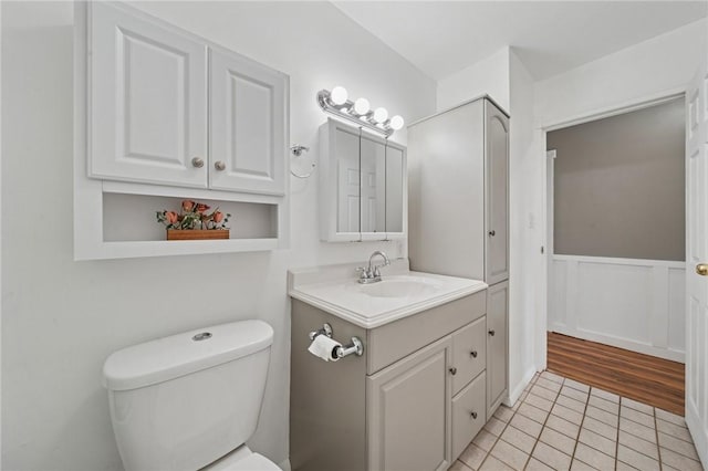213 Mcdonald Dr, North Huntingdon, PA 15642 - bathroom with vanity, tile patterned floors, and wainscoting