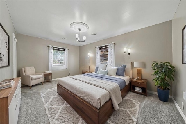 213 Mcdonald Dr, North Huntingdon, PA 15642 - bedroom with light carpet and a chandelier
