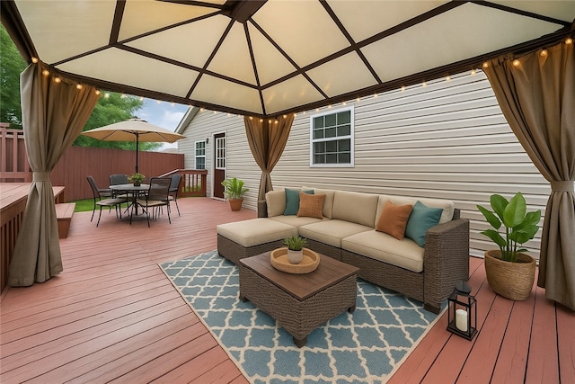 213 Mcdonald Dr, North Huntingdon, PA 15642 - deck featuring a gazebo, outdoor dining area, and an outdoor hangout area