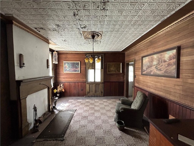 653 Upr Middletown Rd, Menallen Twp, PA 15480 - living room featuring wood walls, crown molding, an ornate ceiling, and a chandelier
