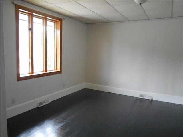 321 E 4th St, Derry Twp, PA 15627 - empty room featuring healthy amount of natural light, dark wood finished floors, and a paneled ceiling