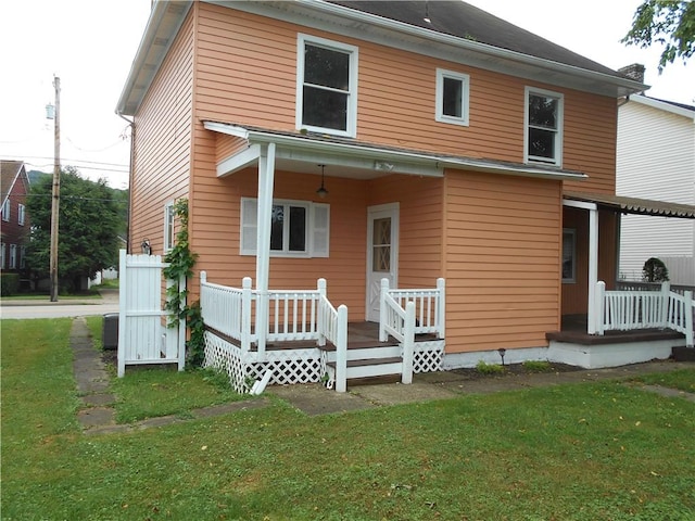 321 E 4th St, Derry Twp, PA 15627 - rear view of property with a yard and a porch