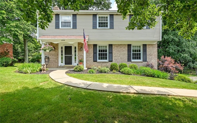 2712 Champlain, Shaler, PA 15101 - view of front of home with brick siding, a front lawn, and covered porch