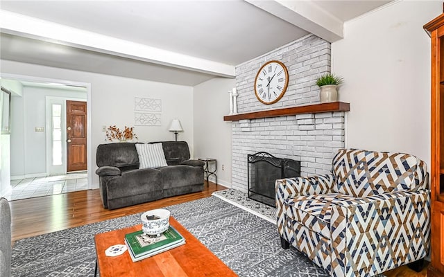 2712 Champlain, Shaler, PA 15101 - living area featuring beamed ceiling, wood finished floors, and a brick fireplace