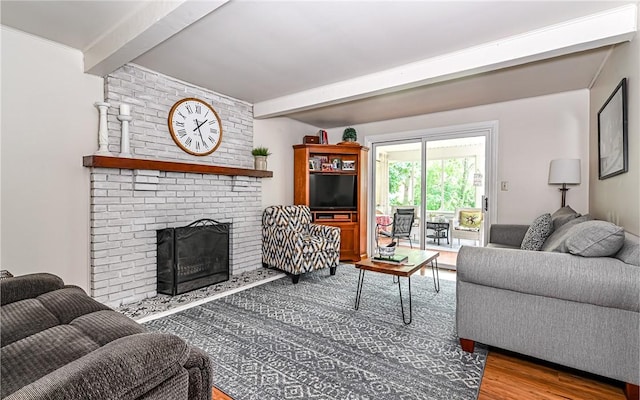 2712 Champlain, Shaler, PA 15101 - living room with wood finished floors, beam ceiling, and a brick fireplace