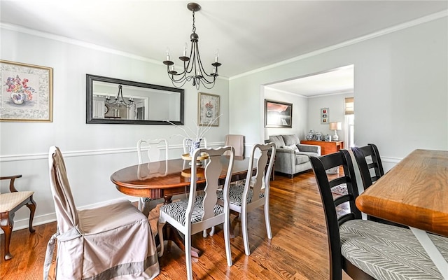 2712 Champlain, Shaler, PA 15101 - dining area featuring crown molding, a chandelier, and wood finished floors