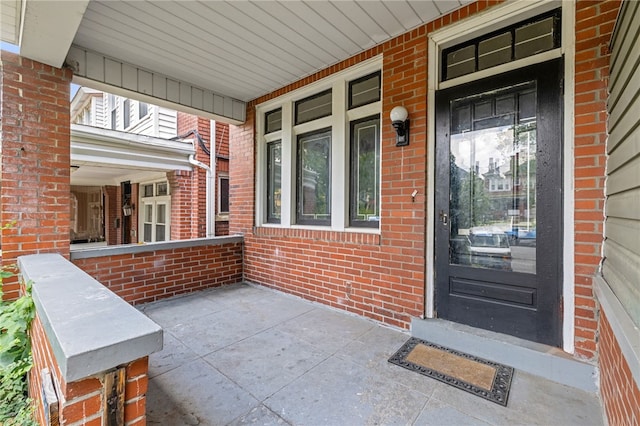 6933 Mcpherson Blvd, Point Breeze, PA 15208 - view of exterior entry with covered porch and brick siding