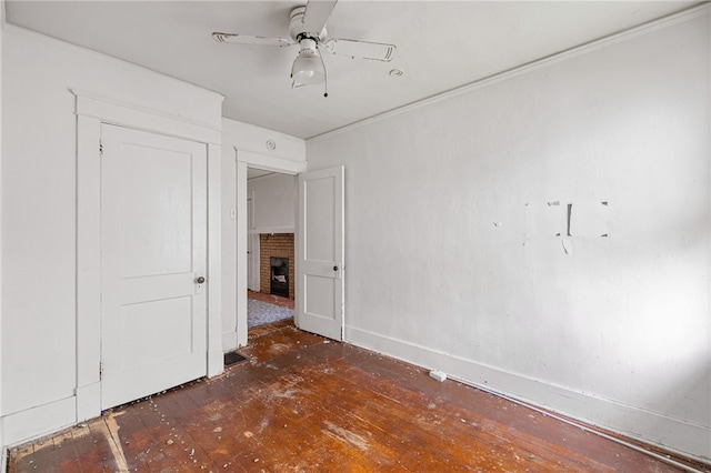 6933 Mcpherson Blvd, Point Breeze, PA 15208 - unfurnished bedroom with a fireplace, wood-type flooring, ornamental molding, and ceiling fan