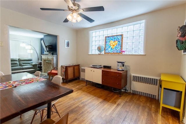 5553 Pocusset St, Squirrel Hill, PA 15217 - dining space featuring radiator heating unit, hardwood / wood-style flooring, and ceiling fan