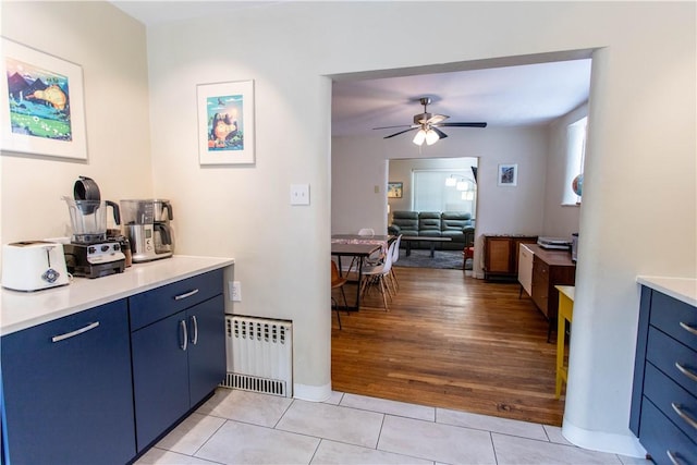 5553 Pocusset St, Squirrel Hill, PA 15217 - bar featuring a ceiling fan, light tile patterned flooring, and radiator heating unit