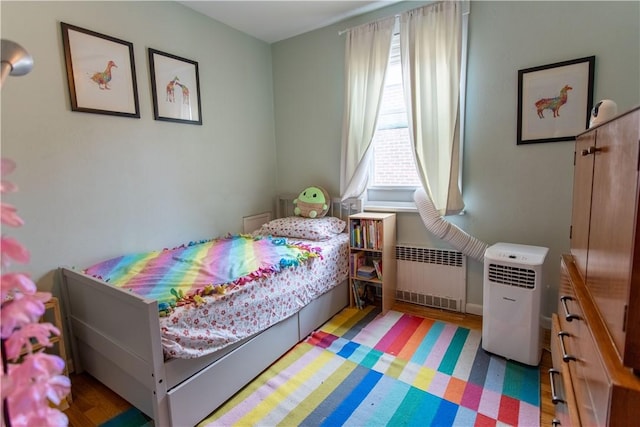 5553 Pocusset St, Squirrel Hill, PA 15217 - bedroom featuring radiator heating unit and wood finished floors