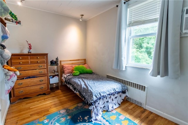 5553 Pocusset St, Squirrel Hill, PA 15217 - bedroom with radiator and hardwood / wood-style floors