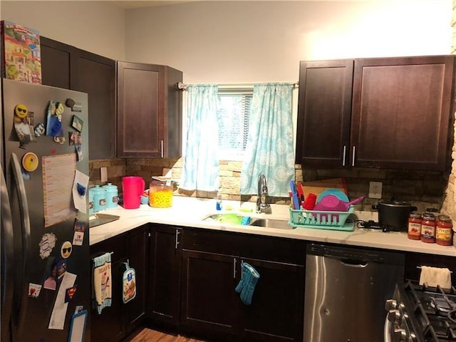 109 Watson Blvd, Perry Hilltop, PA 15214 - kitchen with appliances with stainless steel finishes, light countertops, and dark brown cabinets