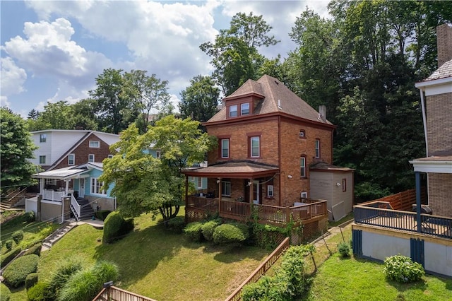 109 Watson Blvd, Perry Hilltop, PA 15214 - back of property with a yard and brick siding