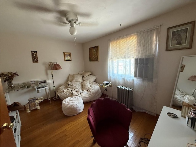 1201 Illinois Ave, Dormont, PA 15216 - bedroom with radiator, wood finished floors, and a ceiling fan