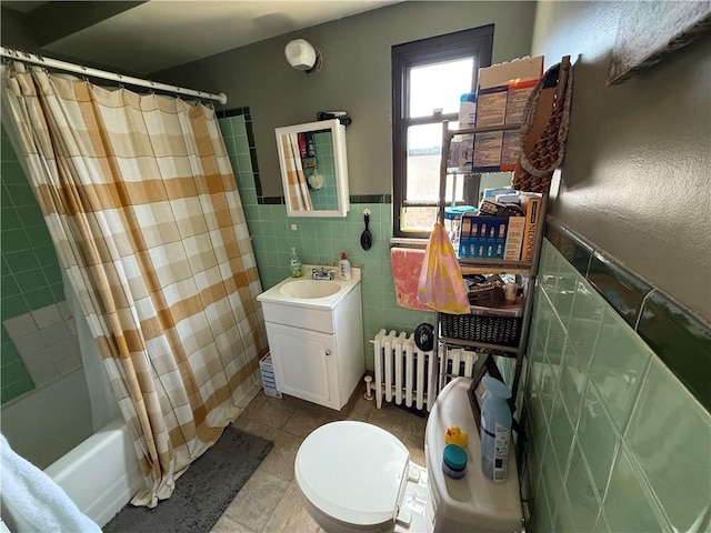 1201 Illinois Ave, Dormont, PA 15216 - full bath with vanity, tile patterned flooring, radiator heating unit, tile walls, and shower / tub combo