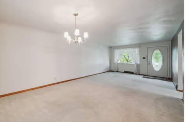 524 Greenridge Rd, New Kensington, PA 15068 - carpeted entryway with a chandelier and baseboards