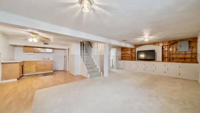 524 Greenridge Rd, New Kensington, PA 15068 - unfurnished living room with stairway and light wood-style flooring