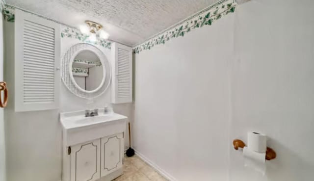 524 Greenridge Rd, New Kensington, PA 15068 - bathroom with a textured ceiling, vanity, and tile patterned floors