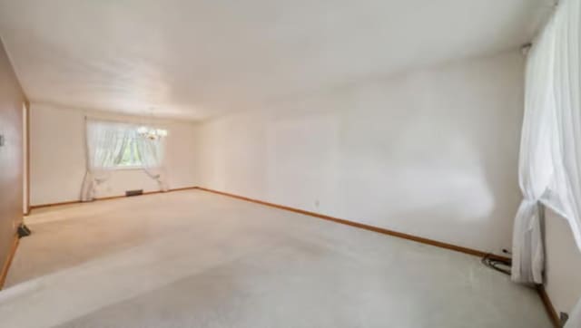 524 Greenridge Rd, New Kensington, PA 15068 - unfurnished room with a chandelier and light carpet