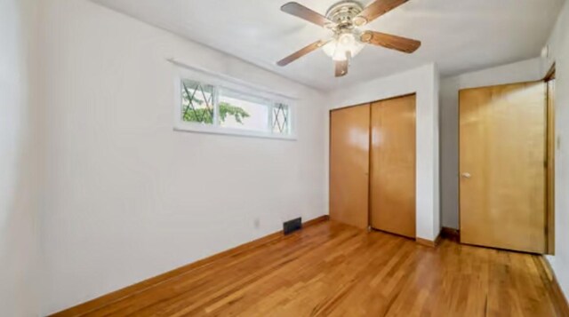 524 Greenridge Rd, New Kensington, PA 15068 - unfurnished bedroom with a closet, light wood-style floors, and a ceiling fan
