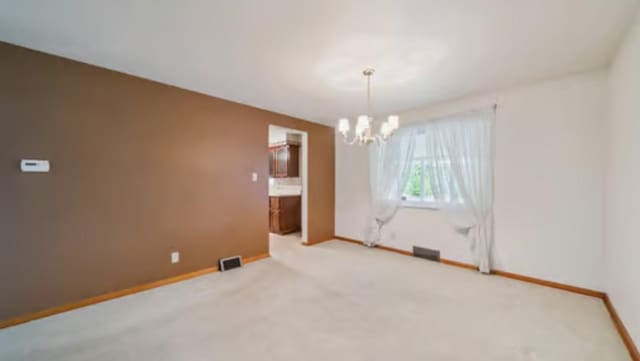 524 Greenridge Rd, New Kensington, PA 15068 - unfurnished room featuring a chandelier and light carpet