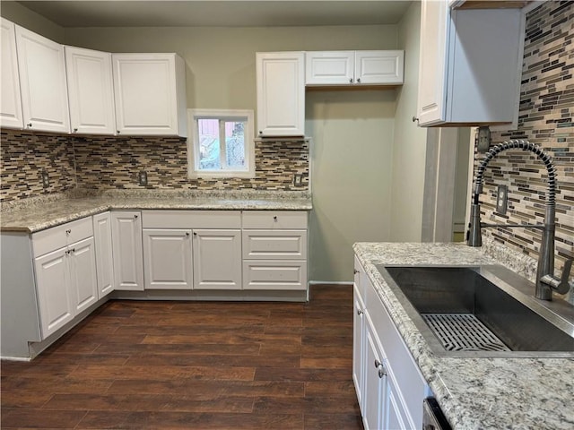 522 Cubbage St, Carnegie, PA 15106 - kitchen featuring backsplash, dark wood finished floors, white cabinets, and light stone counters