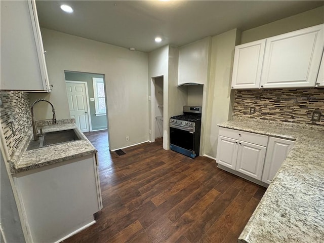 522 Cubbage St, Carnegie, PA 15106 - kitchen featuring stainless steel range with gas stovetop, dark wood-type flooring, backsplash, white cabinetry, and recessed lighting