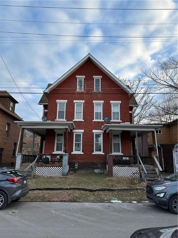 553/555 11th Ave, Beaver, PA 15066 - view of front of property featuring a porch and brick siding
