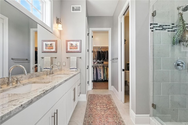 1416 Commons Ln, South Fayette, PA 15017 - bathroom with a stall shower, double vanity, and a walk in closet