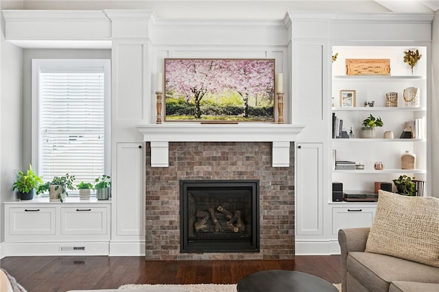 1416 Commons Ln, South Fayette, PA 15017 - living room with dark wood-type flooring and a brick fireplace