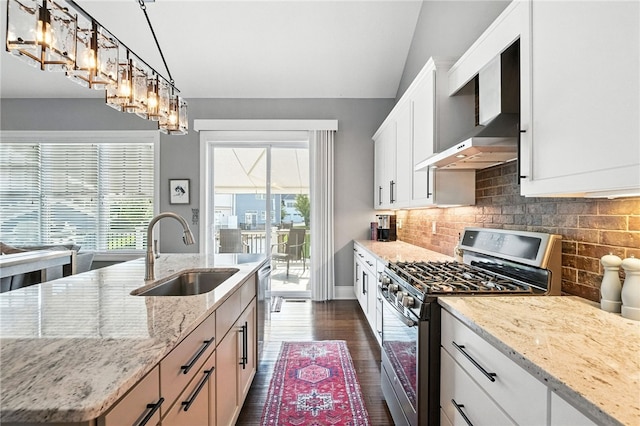 1416 Commons Ln, South Fayette, PA 15017 - kitchen with appliances with stainless steel finishes, light stone countertops, white cabinetry, dark wood-style flooring, and tasteful backsplash